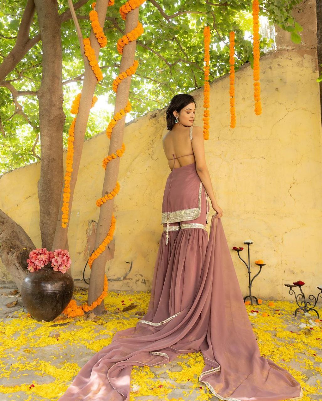 Free Photos - A Woman With Dark Hair Wearing A Stylish Blue Dress, Possibly  An Indian Saree, As She Poses Against A Yellow Wall. Her Expression And Pose  Create An Elegant And